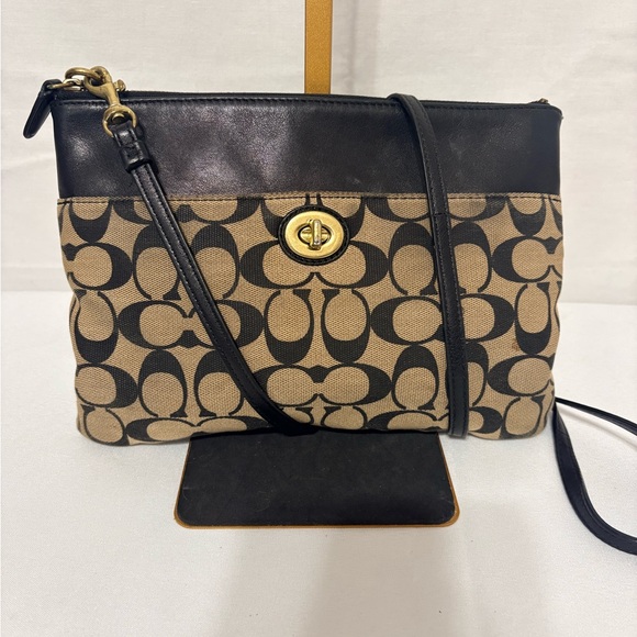 Canvas crossbody bag in khaki and black with a turnlock closure. - Picture 2 of 9